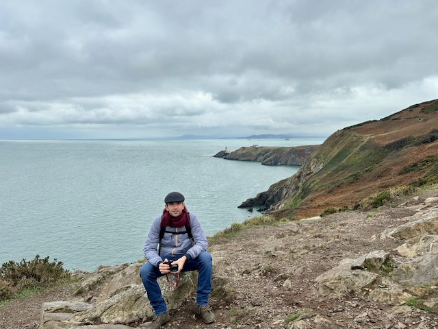 Profile Picture of Adrián Moreno (@zetxek), working side by side with a colleague: sitting on a desk, while looking at a screen